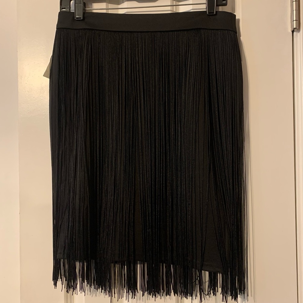 Cato skirt. Black with fringes. Size says M but it is small.